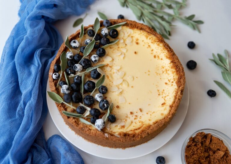 A top view of cheesecake with blueberries on top