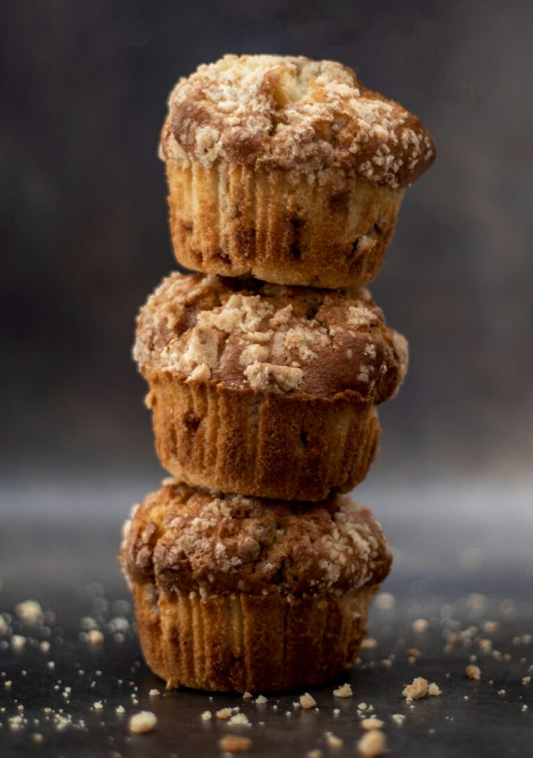 a stack of muffins with nuts